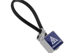 The Zinc Alloy Square Custom Keychain with PVC Rope has a gleaming metal surface.