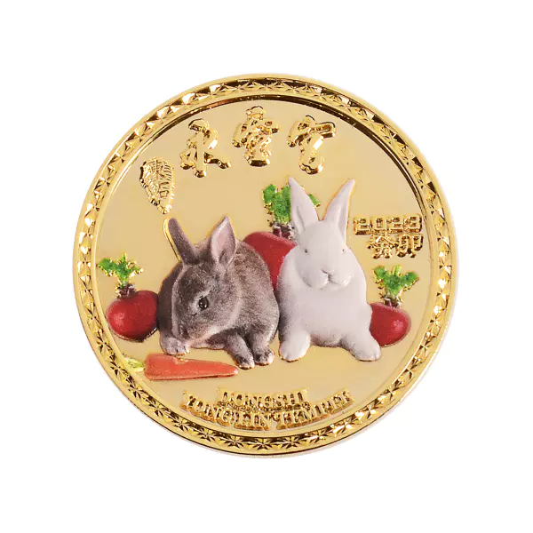 Gray and white rabbits on the metal coin